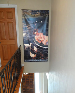 Art Museum Street Banner hanging above a stairwell. Banner has an image of Summertime by Mary Cassat .